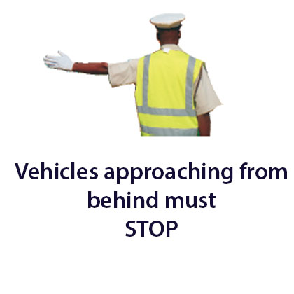 Traffic control officer - Zimbabwe police signals road sign