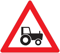Slow farm traffic ahead - Zimbabwe warning signs road sign